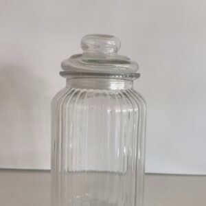 ribbed glass storage jar with a lid